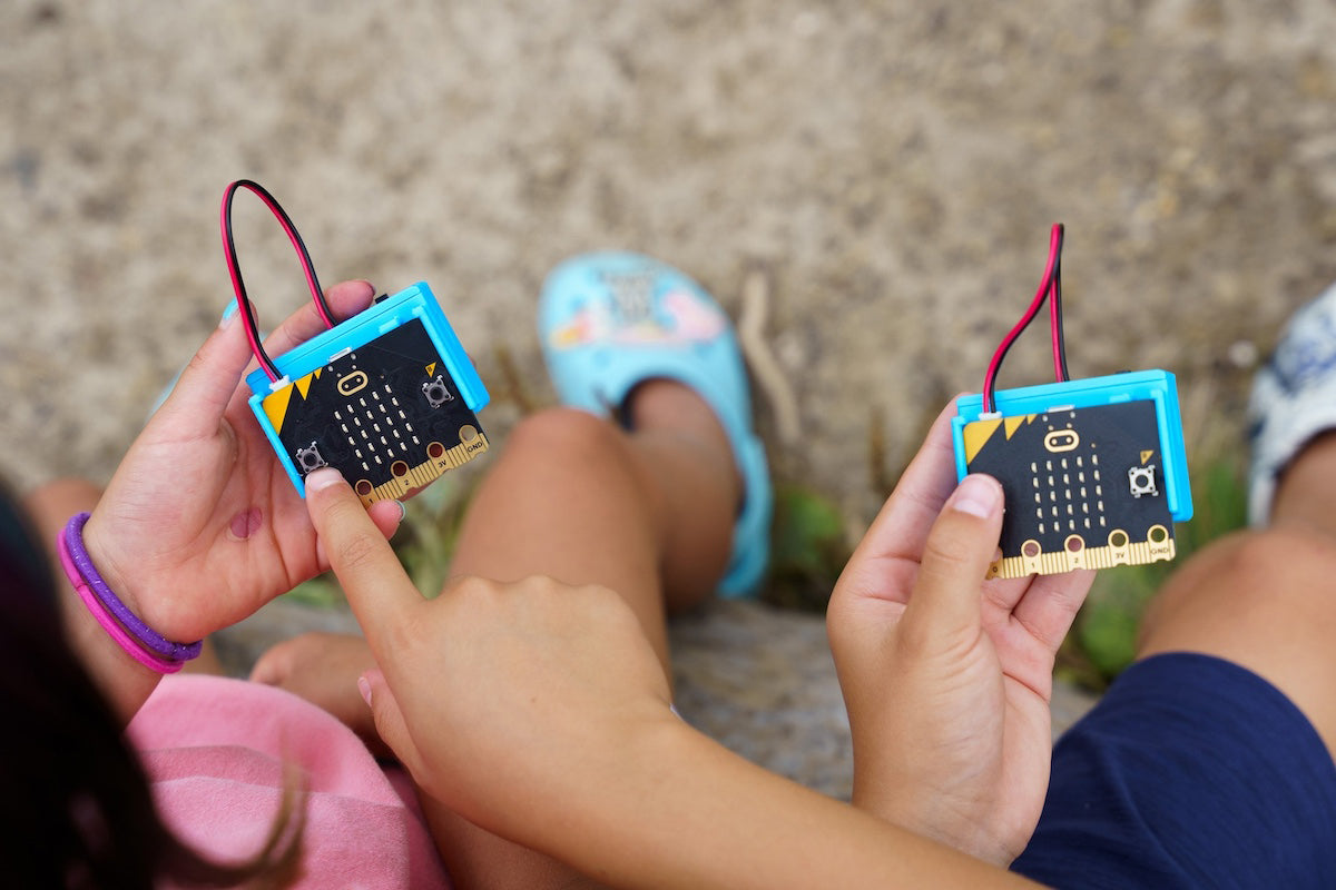 Two students using CHARGE for micro:bit device