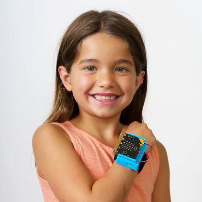 Female student smiling wearing CHARGE for micro:bit on her wrist